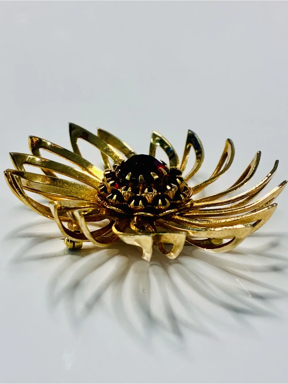 Sarah Coventry Gold-tone Sunburst Brooch with Deep Red Center